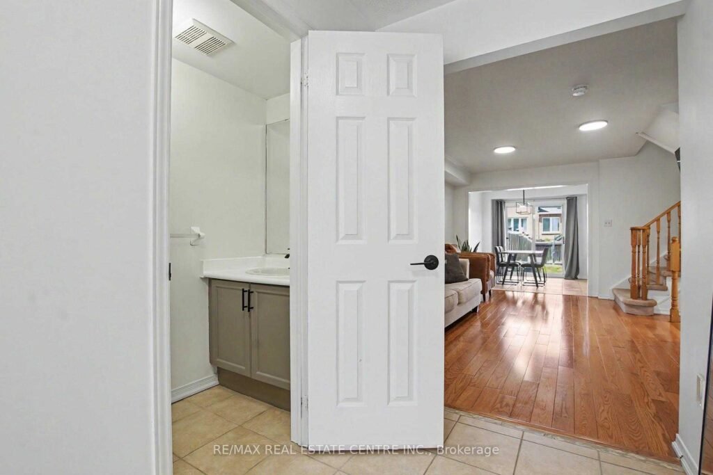 94 Timbertop Crescent, Brampton - hallway from the foyer looking toward the main living area, hardwood floors