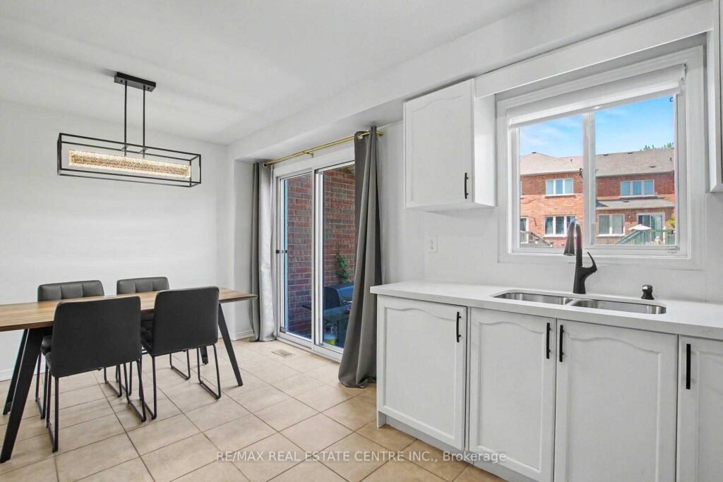 94 Timbertop Crescent, Brampton - kitchen and dining area with window