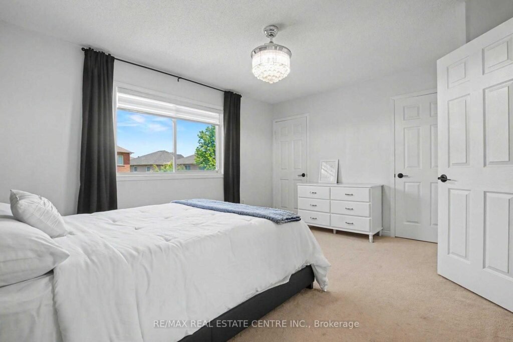 94 Timbertop Crescent, Brampton - second-floor bedroom with window and closet