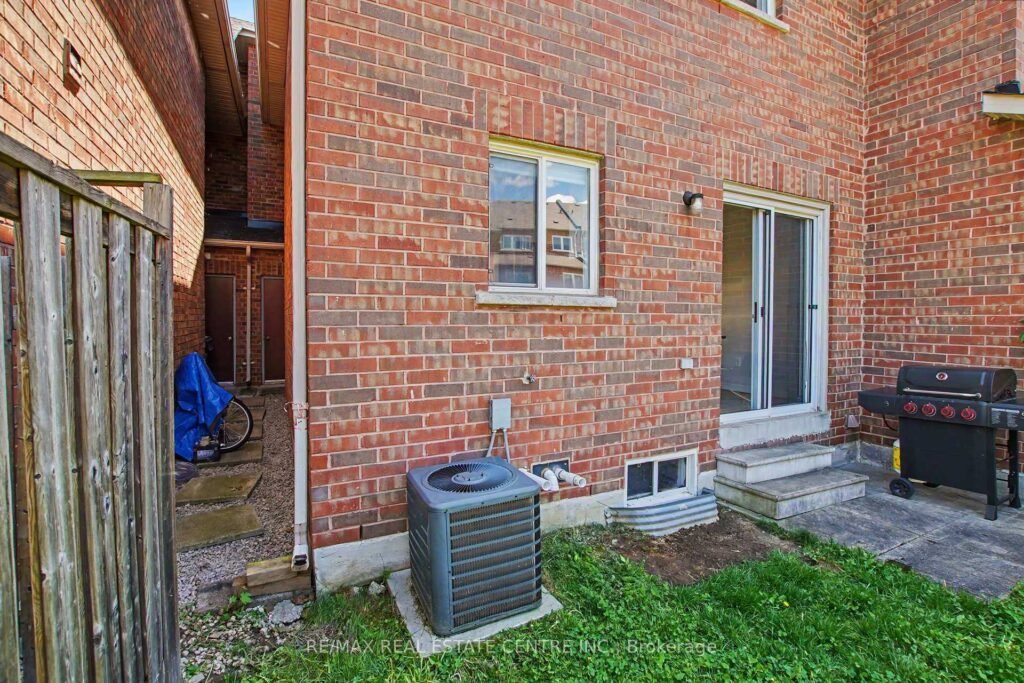 94 Timbertop Crescent, Brampton - side of the home with the central air conditioning unit